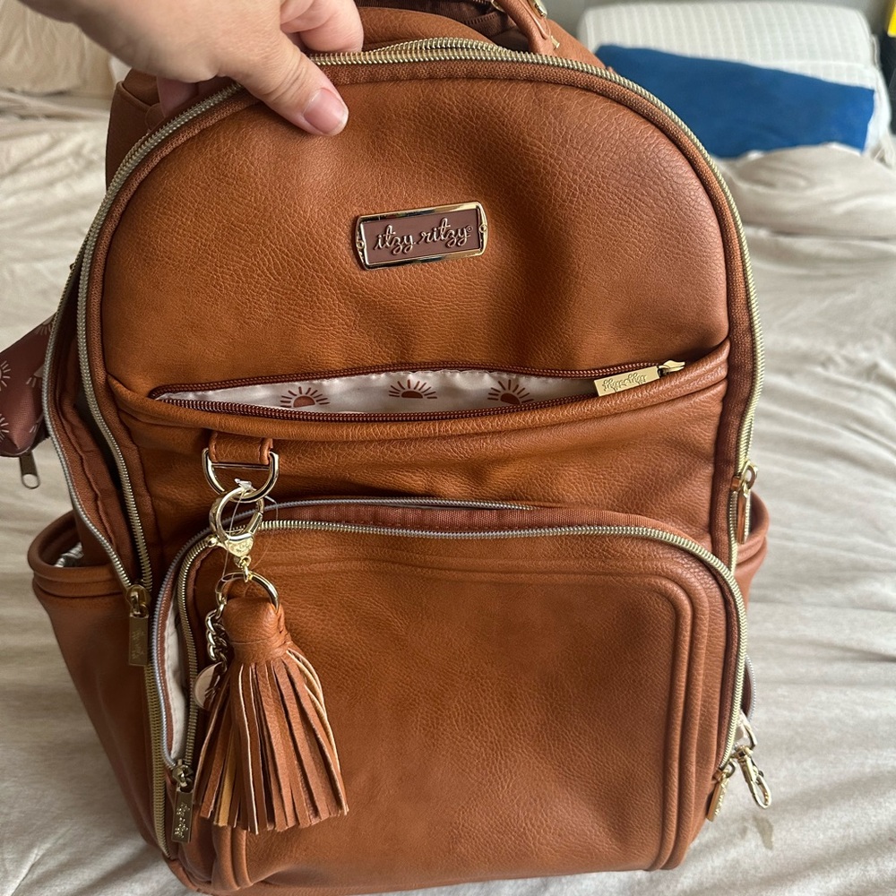 Itzy Ritzy Tan Backpack with Tassel